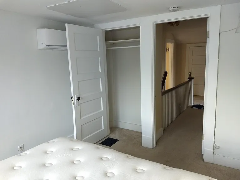 Bedroom #3 showing closet and hallway to stairs (2nd floor).