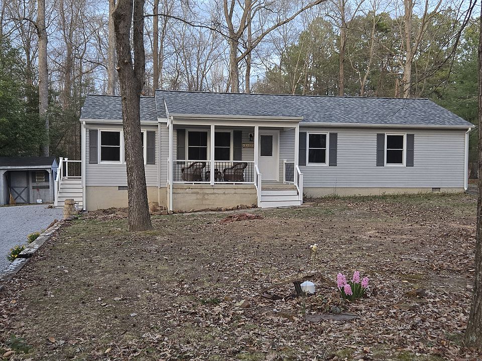 House front from road, driveway and shed location