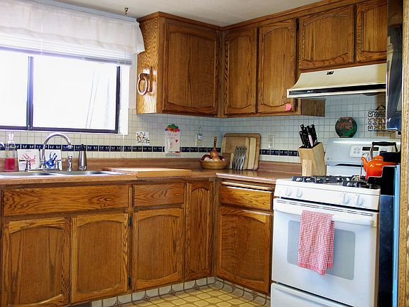 Kitchen offers oak cabinets.