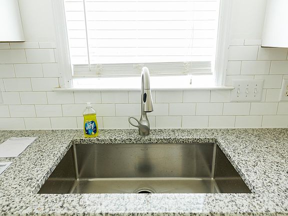 Granite countertops with subway tile backsplash