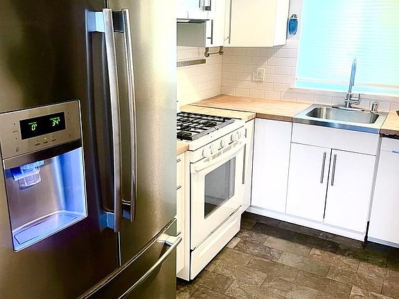 Kitchen includes refrigerator (for life of refrigerator)