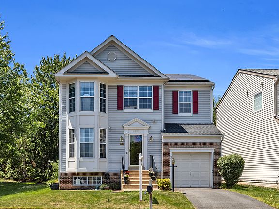 Curb appeal with attached garage and welcoming front porch