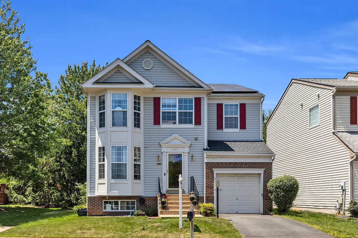 Curb appeal with attached garage and welcoming front porch - 6802 Dewars Way