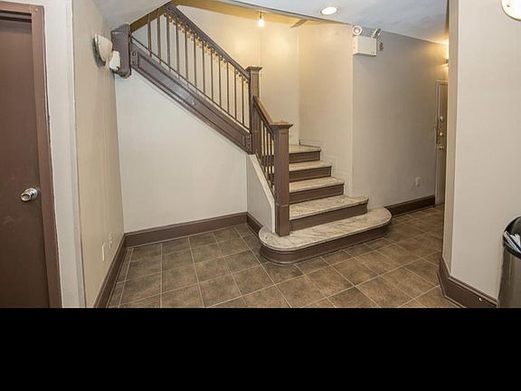 Main lobby stairwell for a quick walk up to unit #201. Basement door on the left for access down to laundry, trash and recycling or choose to take the elevator up or down to the basement.