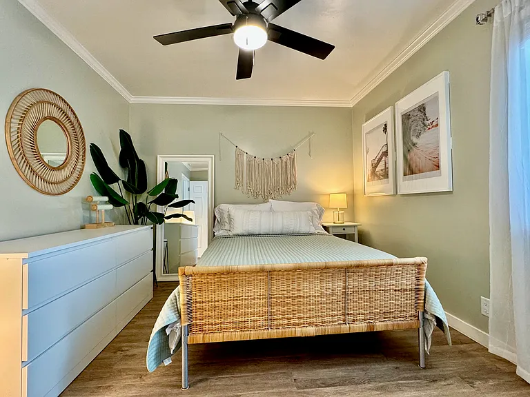 Extra cozy full/double size bed with firm mattress and Tempur-Pedic mattress topper, ceiling fan, chest of drawers, jewelry stand, large closet with plenty of hangers, and attached bathroom
