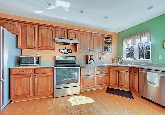 The kitchen features newer granite counter tops and 3 year old appliances.
