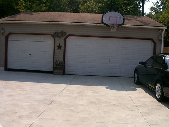 3 car detached garage and new concrete driveway.