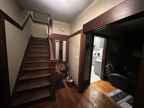 Front Steps up to the 2nd Kitchen and 2nd Floor Bedrooms. Front hall includes a closet. To the right you get a glimpse of the living room and 1st floor, fully remodeled kitchen.