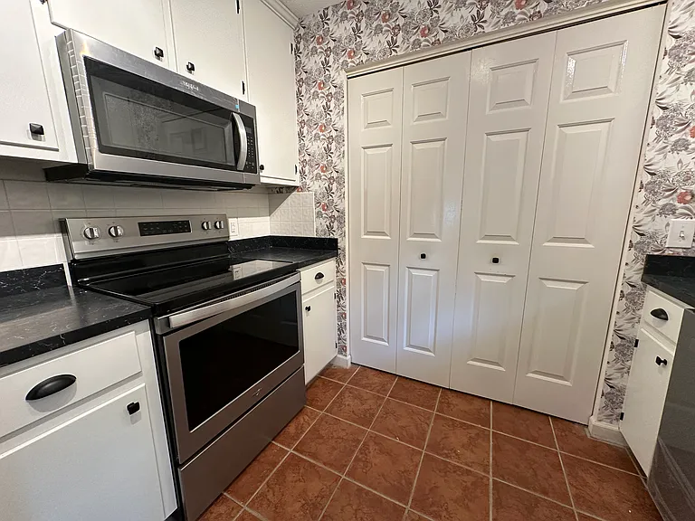 behind the doors is the area for washer and dryer with storage