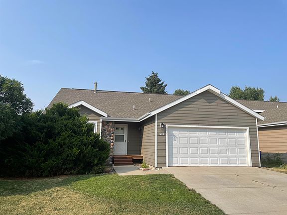Front view with 2 car garage