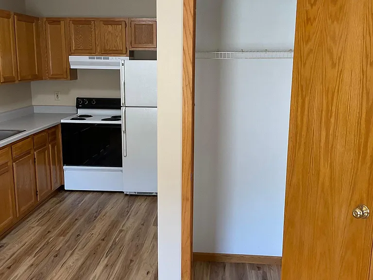 Kitchen & coat closet at entry