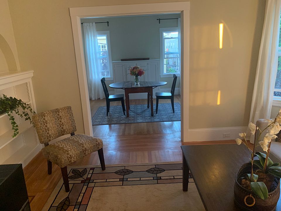 Living room with dining room in the distance. Dining room is on the street