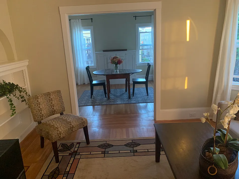Living room with dining room in the distance. Dining room is on the street