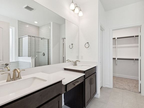 Elegant owner s bathroom with dual vanity real home pictured