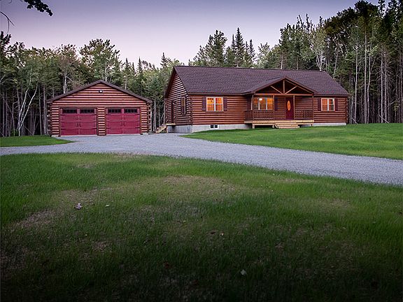 Completed front view of log sided home