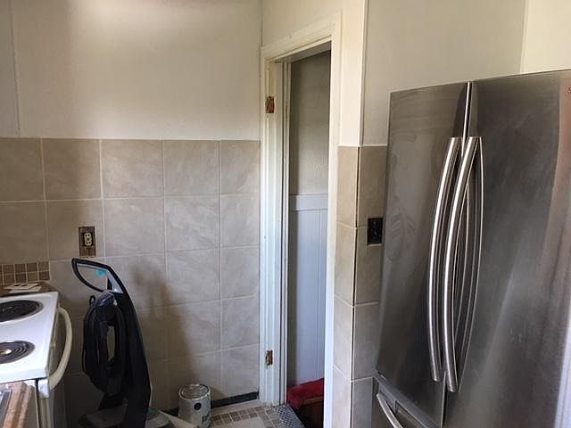 New tile, new fridge in kitchen