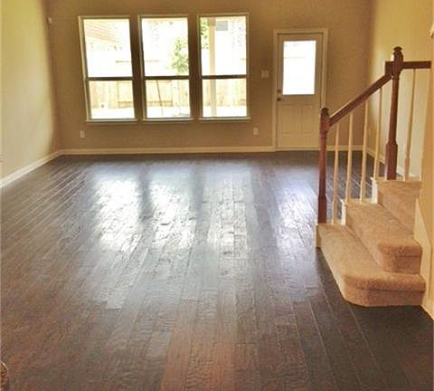 The family room features a vaulted ceiling, rich hardwood floors and beautiful windows overlooking the backyard!