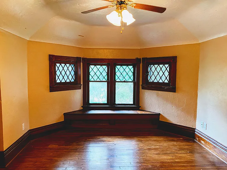 Bedroom 2 with built in window bench. (unfurnished)