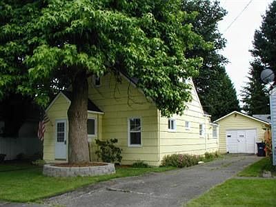 Front view including garage