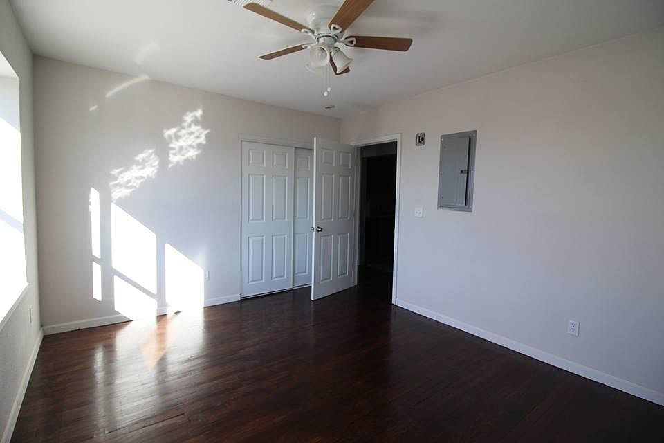 Large master bedroom with big picture window.