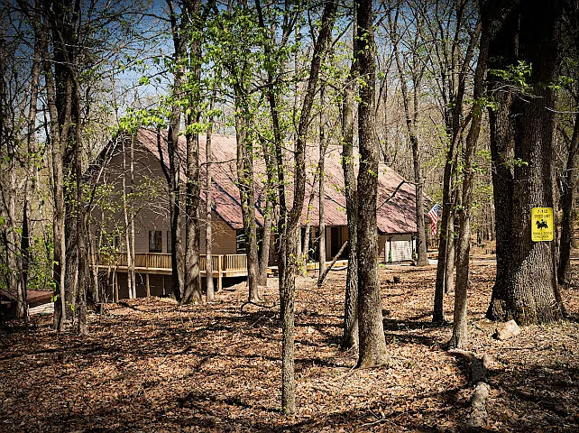 Secluded Forest House Near Beaver Lake | Rogers, AR Getaway Tucked among towering hardwoods on a private wooded lot, this retreat delivers true Ozark wilderness. Minutes from Beaver Lake, Hobbs State Park, and Crystal Bridges Museum. Wake up to birdsong!