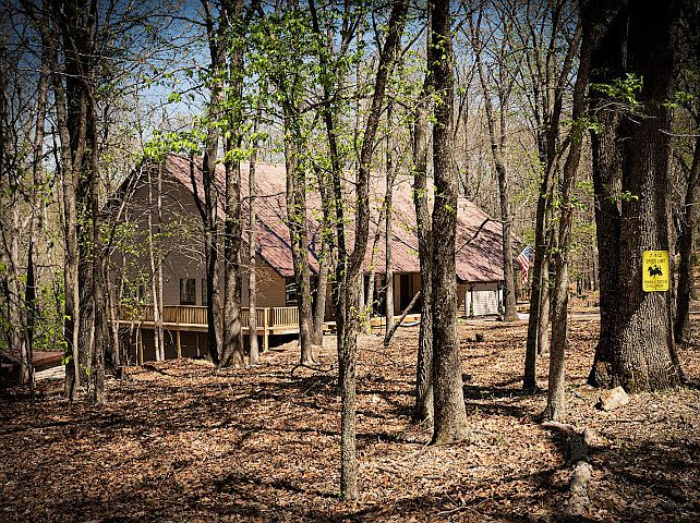 Secluded Forest House Near Beaver Lake | Rogers, AR Getaway Tucked among towering hardwoods on a private wooded lot, this retreat delivers true Ozark wilderness. Minutes from Beaver Lake, Hobbs State Park, and Crystal Bridges Museum. Wake up to birdsong!