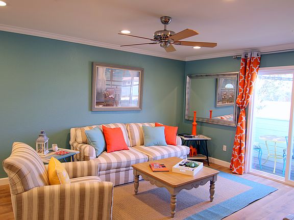 View of the living room.Balcony off the living room with sliding glass doors
