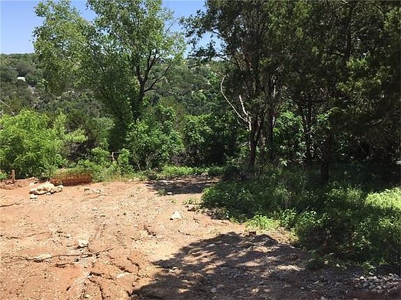 From the road, the lot boasts a deep layout, great views, and tall trees.