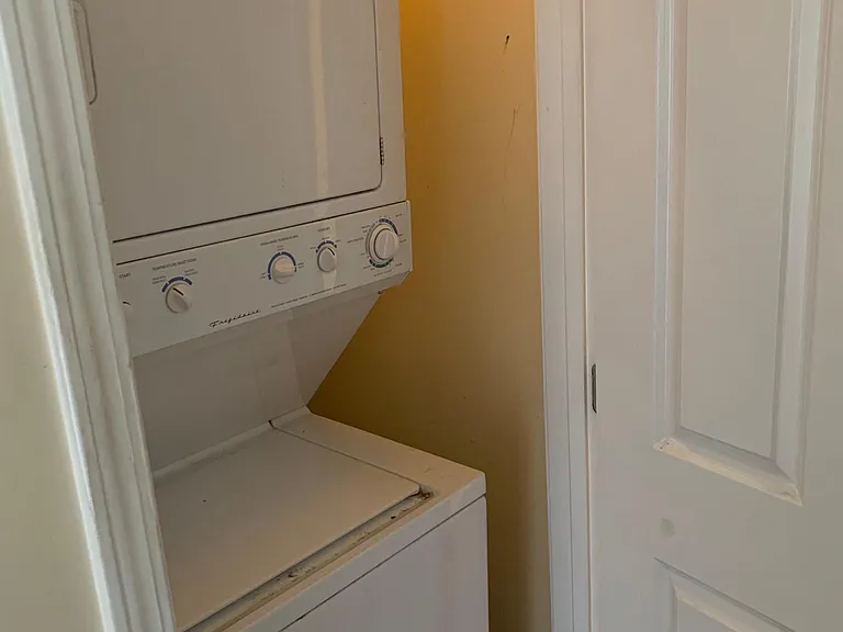 Indoor laundry conveniently accessible from both bedrooms