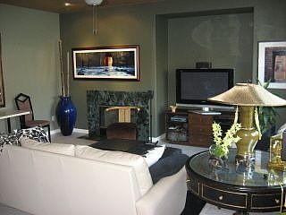 Cozy den with fireplace.