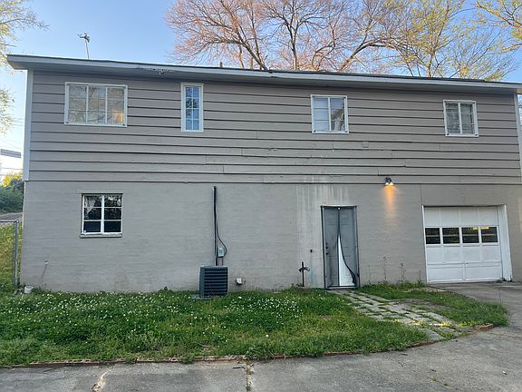 Rear view showing garage door for covered parking