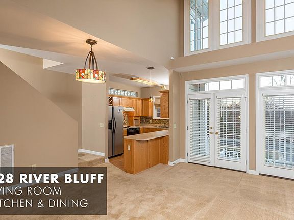 Living Room, Kitchen, and Dining Area Looking out to Covered