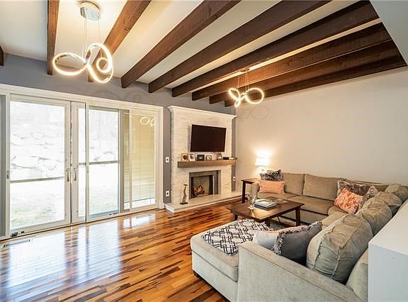 Spacious living room with fireplace and sliding doors to yard