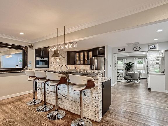 Kitchen with granite bar sitting area