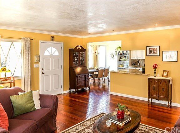 Living Room with rich colored flooring