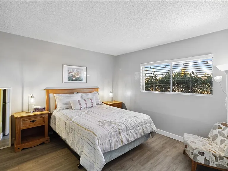 Bedroom 2: Facing the front of the house with a comfy queen size bed.