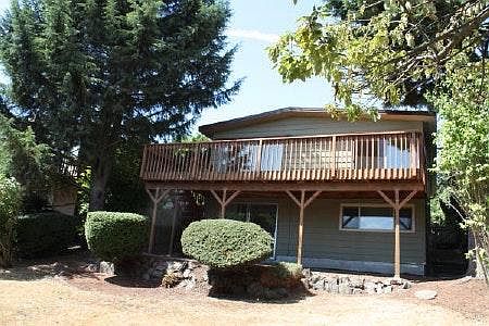 back of house with deck