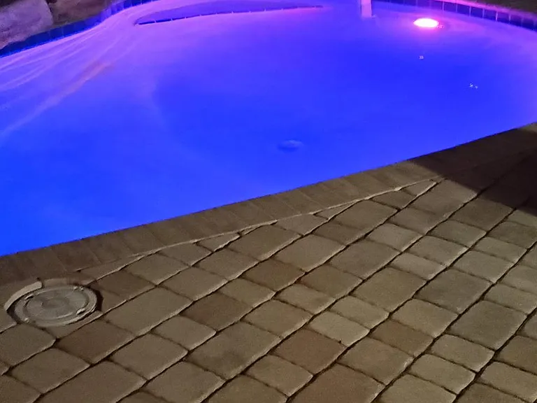 Lighted pool for nighttime swimming
