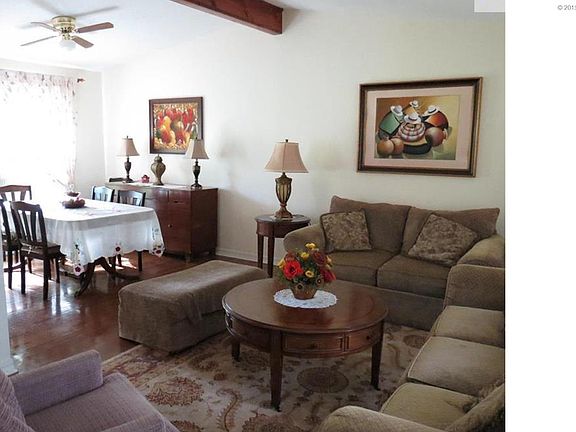 Spacious living room/dining room.  Hardwood floors have been refinished.