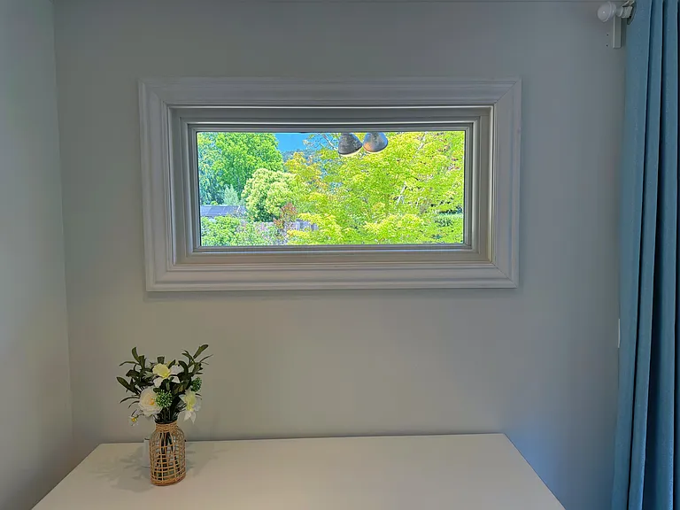 Picture window in primary bedroom