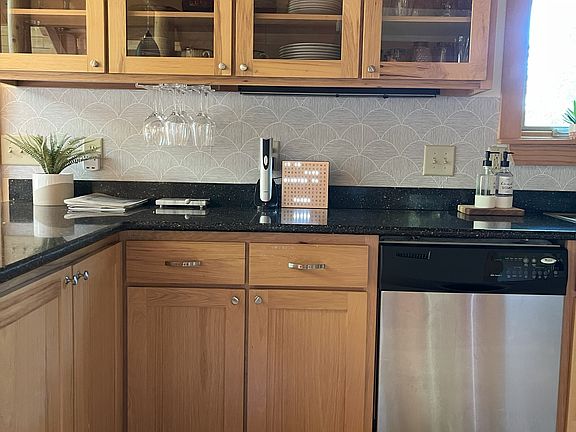 2nd floor, main level: Living room with queen-sized sleeper sofa, 55" Roku HDTV, full stocked kitchen with gas stove, dishwasher, full-sized refrigerator, breakfast nook, full bathroom.