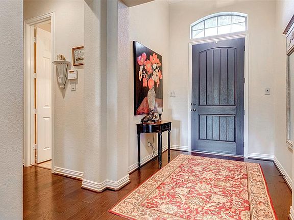 The foyer has wood floors.