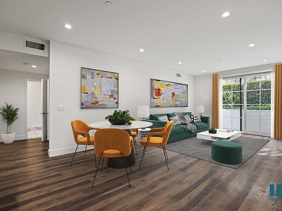 Open-Concept Dining and Living Room with Patio and Large-Size Windows