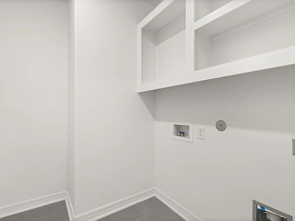 Utility room. Note Sample product photo - actual exterior and interior selections may vary by homes