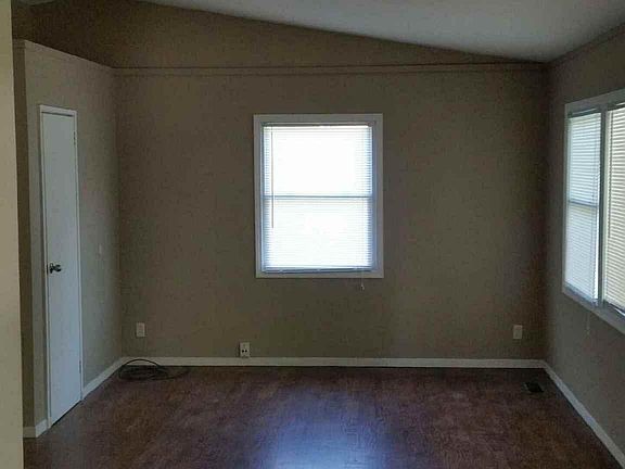 Original walnut hardwood floors with vaulted ceilings.