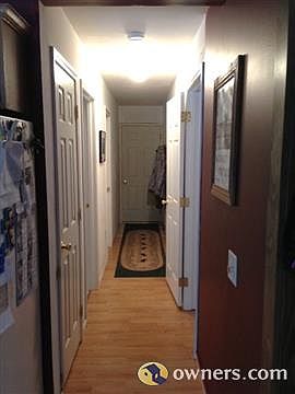 Hallway off kitchen to bathroom / bedroom / garage entrance
