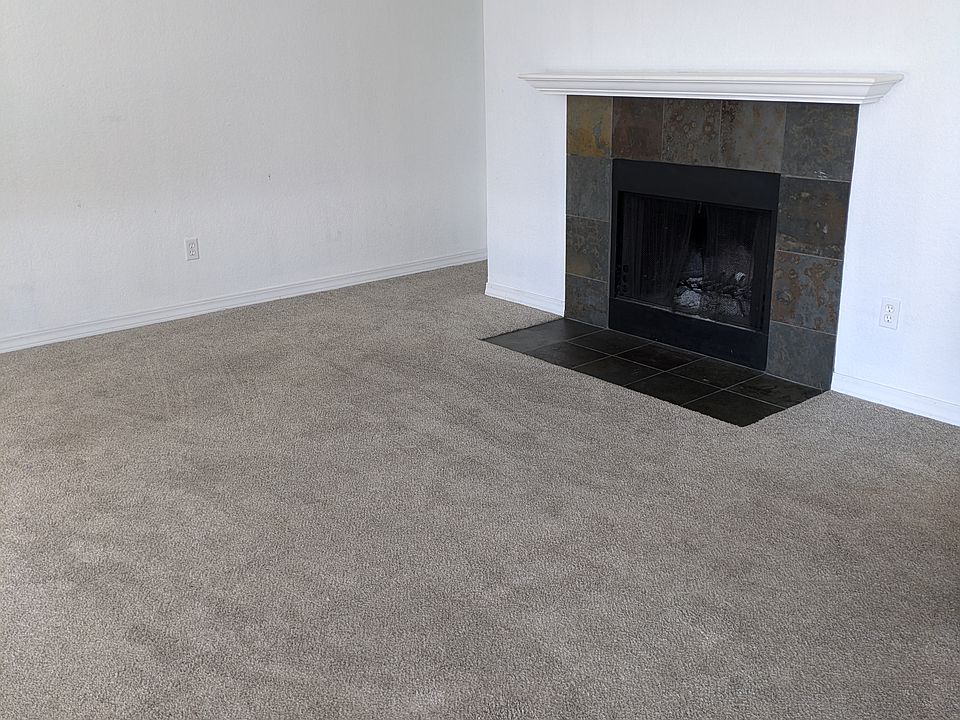Living room with functional fireplace.