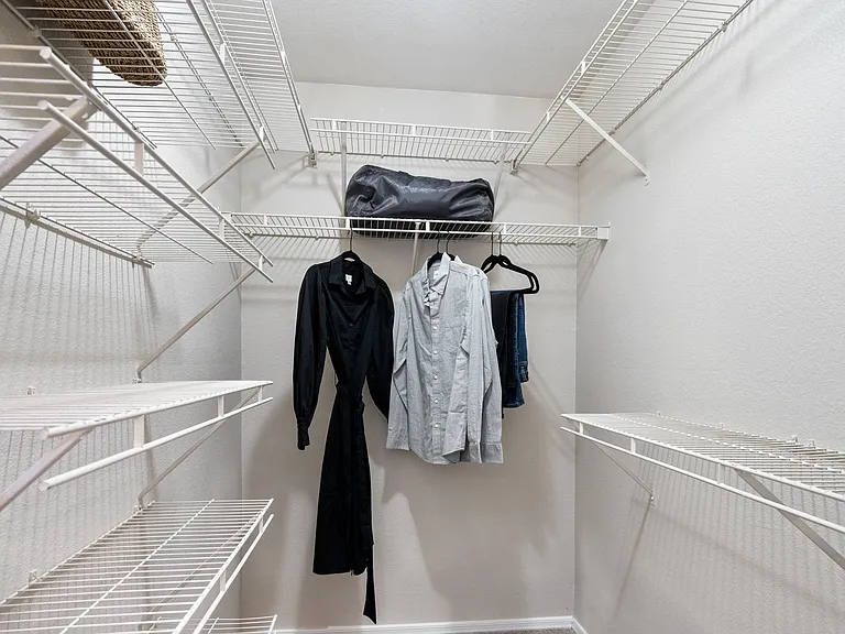 Blurb- Stay organized with a spacious walk-in closet featuring built-in shelving for effortless storage. Designed for style and convenience, it's the perfect fit for your lifestyle.