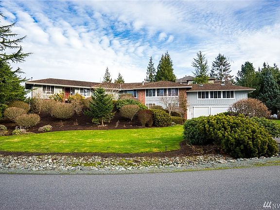 Welcome to 3867 Bay Lane. This beautiful view home in the community of Seaview is perfectly sited on a manicured shy half acre l