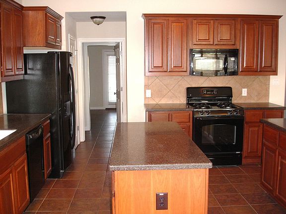 Island kitchen with lots of cupboard and counter space. Butlers pantry off kit
